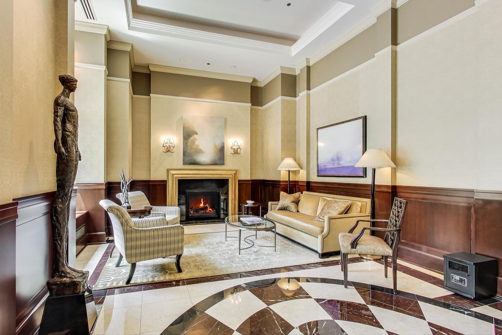 840 North Lake Shore Drive, Unit 2401 Chicago, IL 60611 - Photo 5 of 40 a living room with furniture and a fireplace