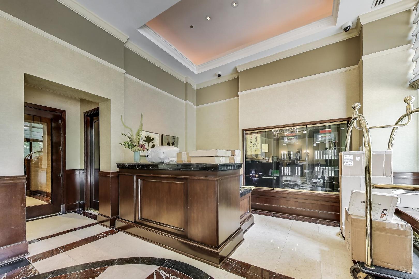 840 North Lake Shore Drive, Unit 2401 Chicago, IL 60611 - Photo 6 of 40 a kitchen with granite countertop a stove and cabinets