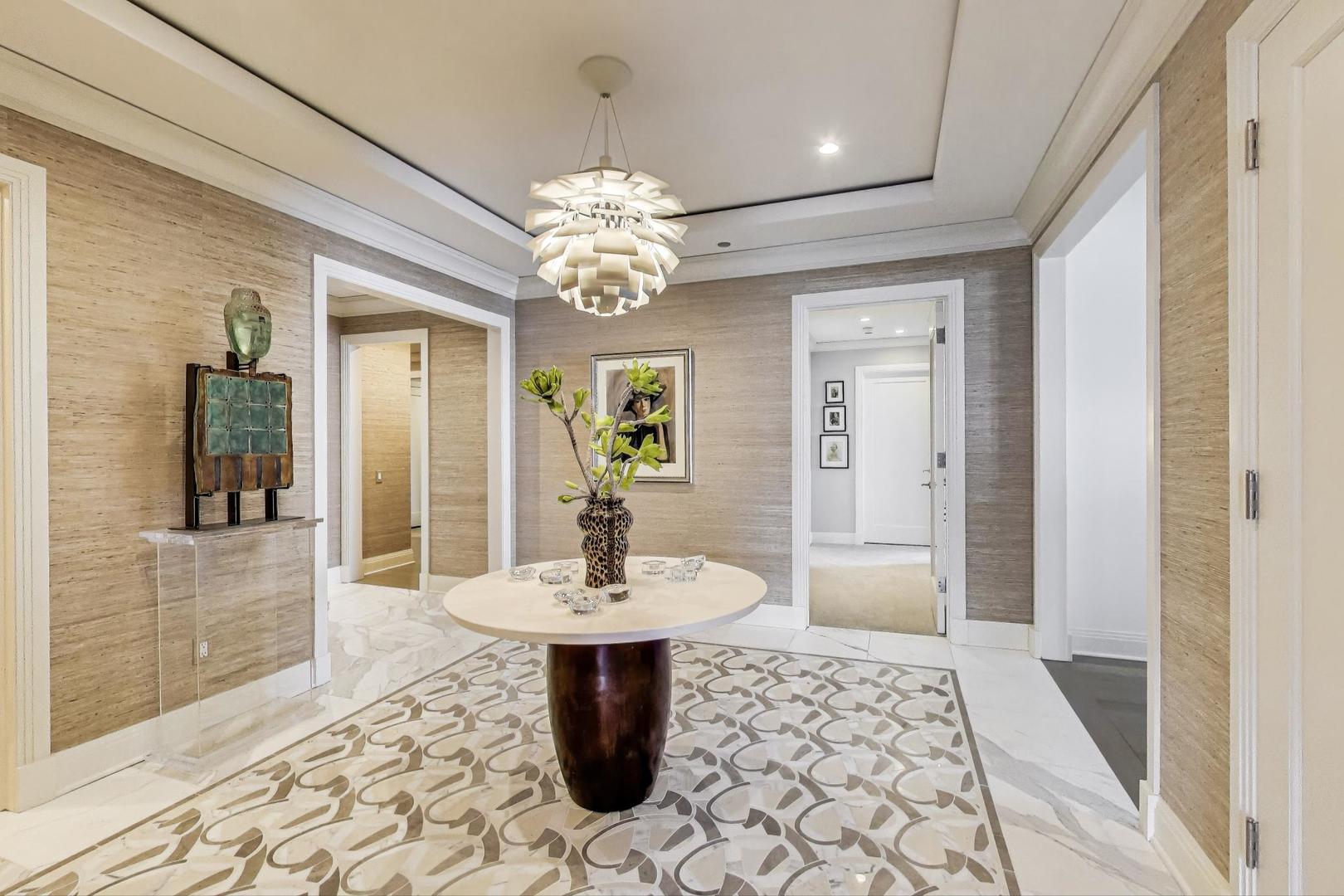 840 North Lake Shore Drive, Unit 2401 Chicago, IL 60611 - Photo 8 of 40 a view of a dining room with furniture