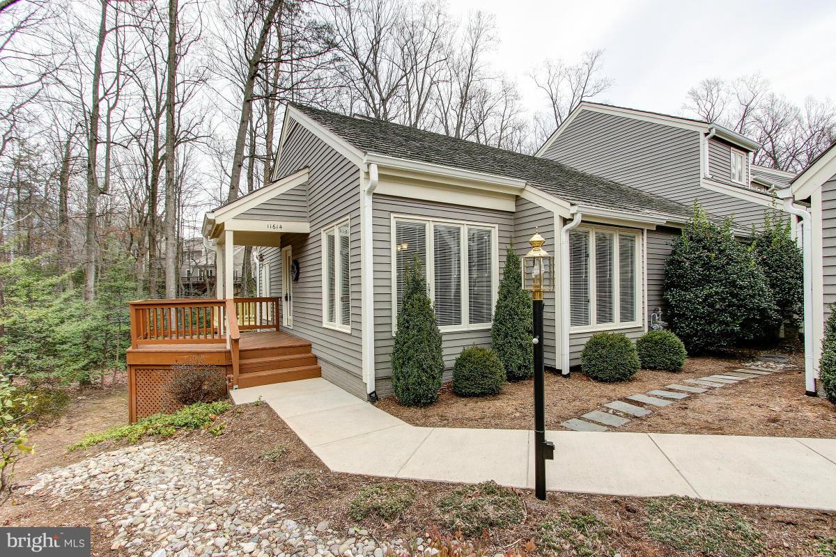 11614 Chapel Cross Way Reston, VA 20194 - Photo 1 of 30 a front view of a house with garden