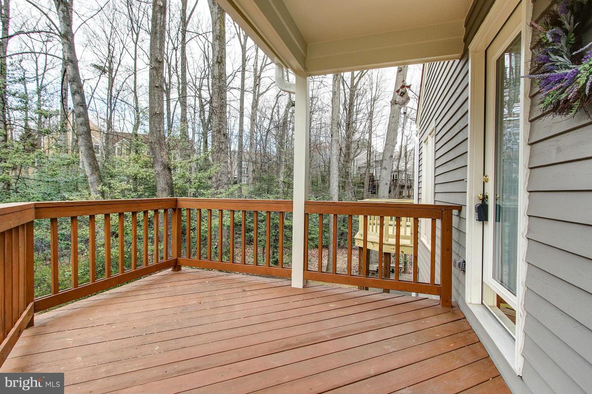 11614 Chapel Cross Way Reston, VA 20194 - Photo 3 of 30 a view of a balcony with wooden floor
