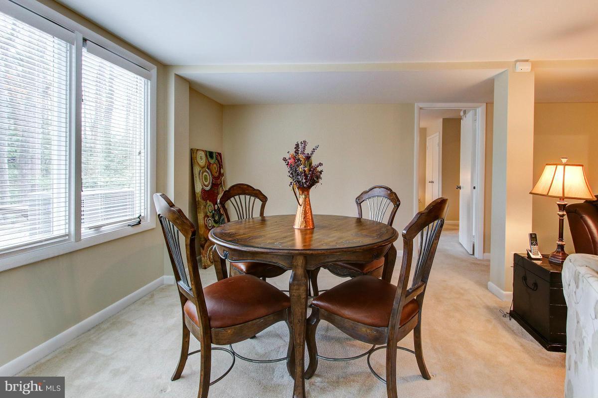 11614 Chapel Cross Way Reston, VA 20194 - Photo 22 of 30 a view of a dining room with furniture and a potted plant