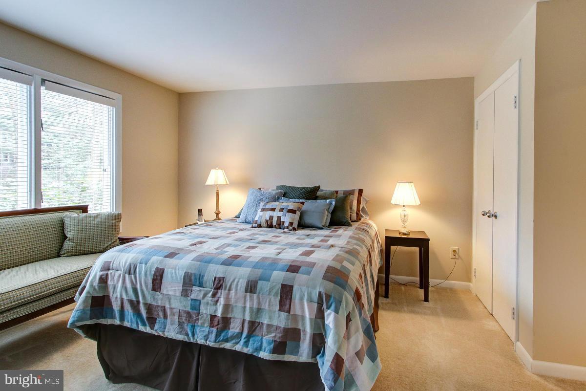 11614 Chapel Cross Way Reston, VA 20194 - Photo 23 of 30 a bedroom with a bed and window