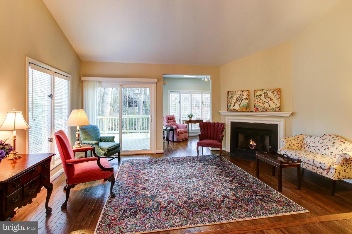 11614 Chapel Cross Way Reston, VA 20194 - Photo 4 of 30 a living room with furniture and a fireplace