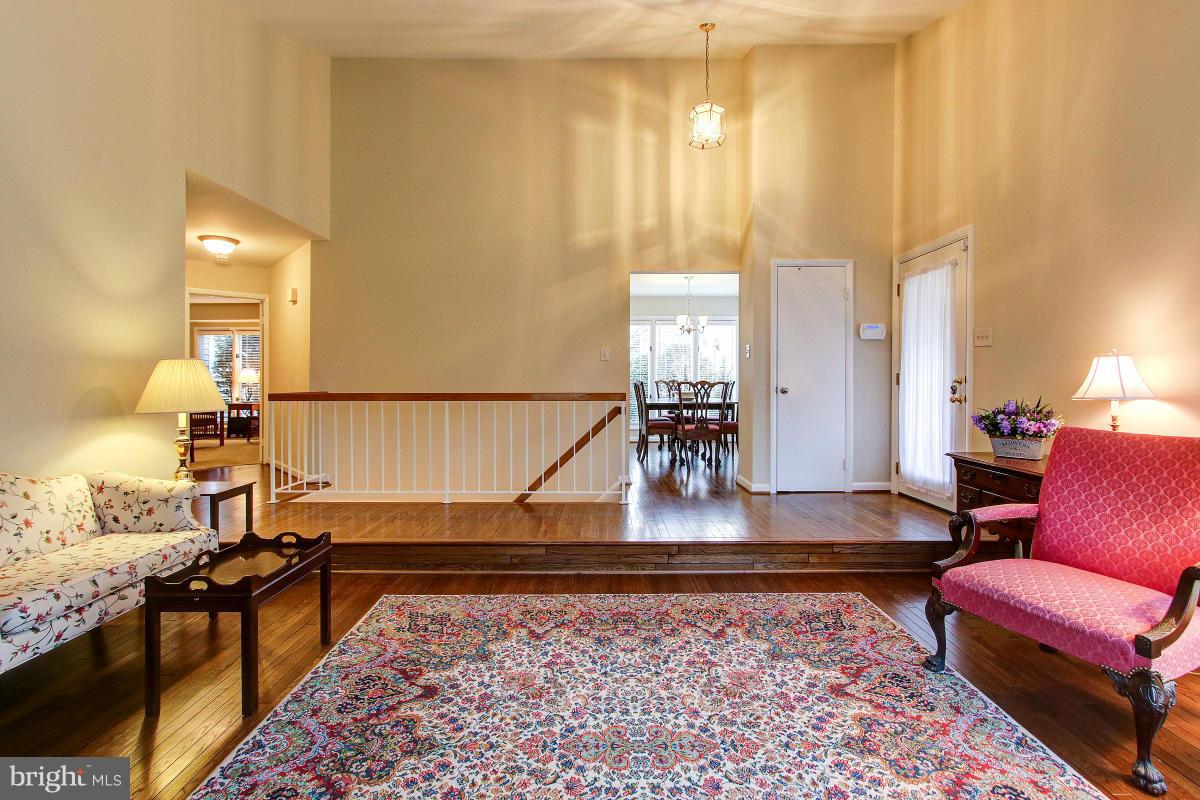 11614 Chapel Cross Way Reston, VA 20194 - Photo 6 of 30 a living room with furniture and a rug