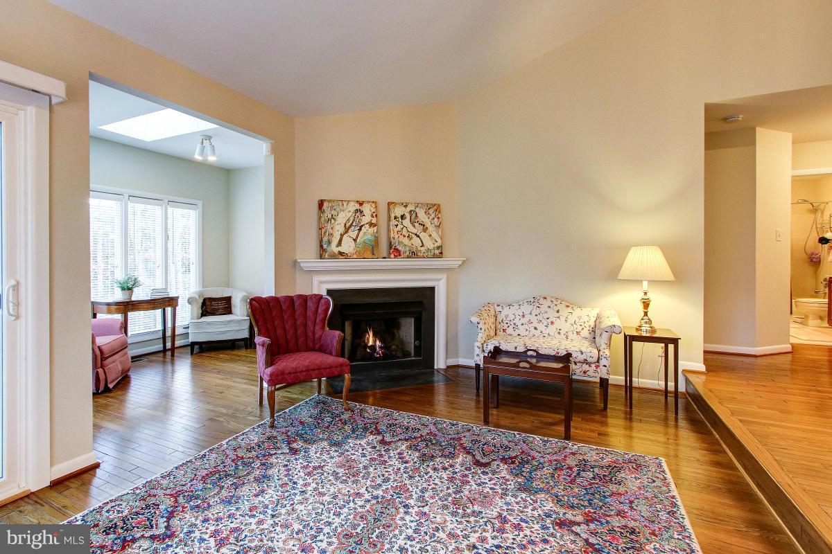 11614 Chapel Cross Way Reston, VA 20194 - Photo 7 of 30 a living room with furniture and a fireplace