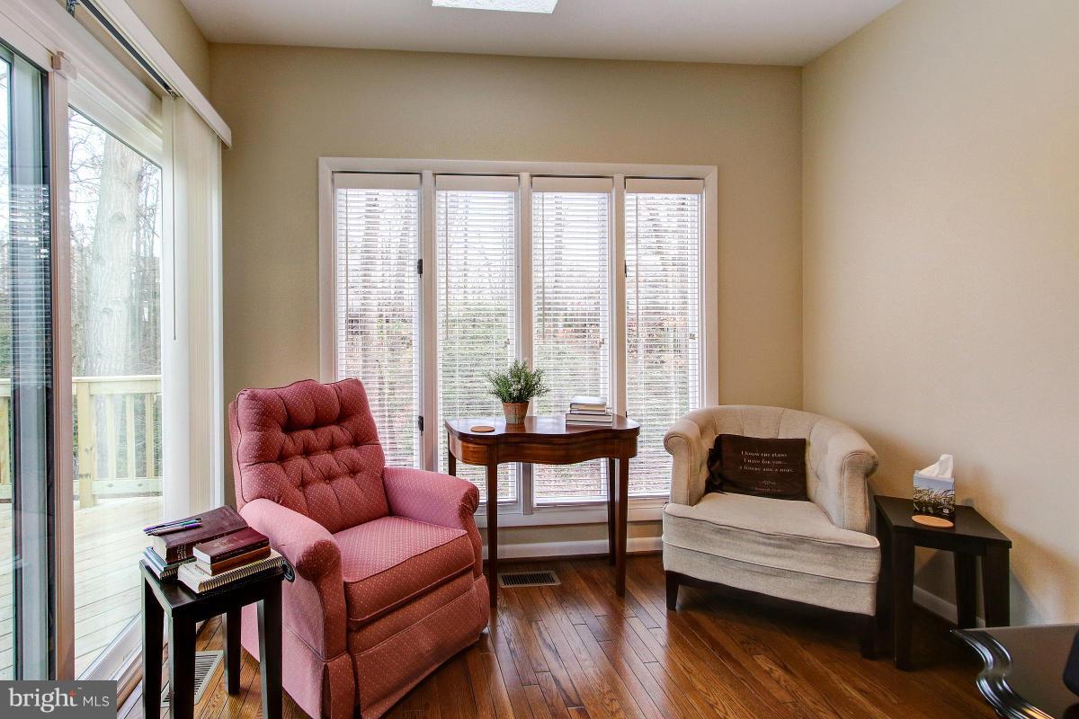 11614 Chapel Cross Way Reston, VA 20194 - Photo 8 of 30 a living room with furniture and a window