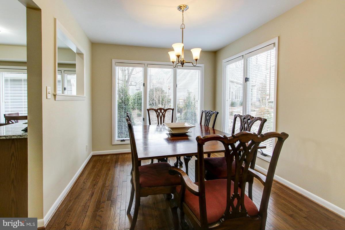 11614 Chapel Cross Way Reston, VA 20194 - Photo 9 of 30 a view of a dining room with furniture window and wooden floor