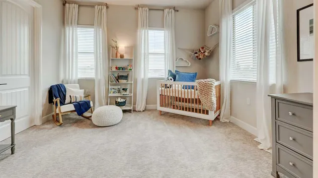 a very nice looking room with a chair and a window