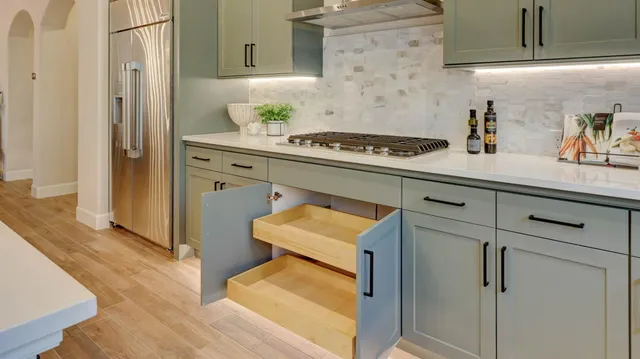 a kitchen with a sink cabinets and appliances