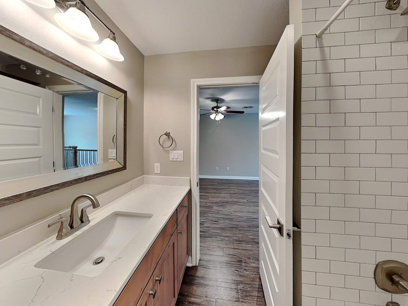 179 Holly Street, Unit 503 Georgetown, TX 78626 - Photo 13 of 18 a bathroom with a sink and mirror