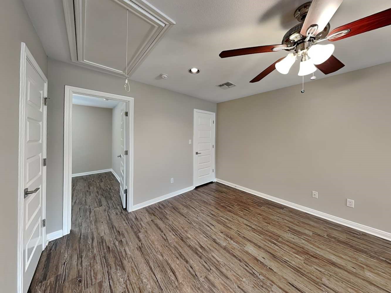 179 Holly Street, Unit 503 Georgetown, TX 78626 - Photo 16 of 18 wooden floor in an empty room with a window
