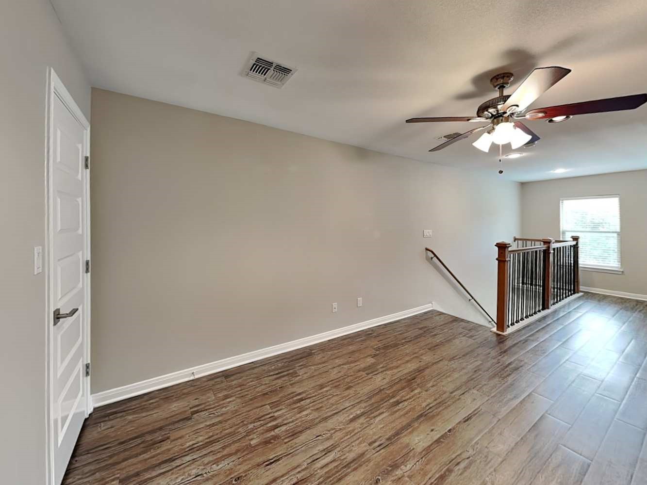 179 Holly Street, Unit 503 Georgetown, TX 78626 - Photo 17 of 18 a view of a livingroom with wooden floor