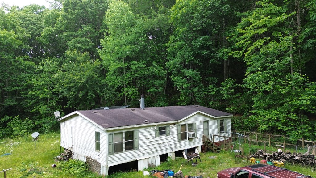 115 Calvender Road Turtletown, TN 37391 - Photo 23 of 23 a aerial view of a house with a yard and large trees