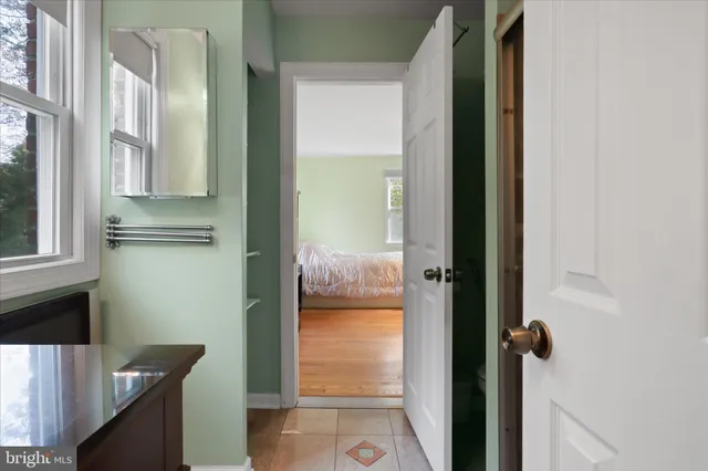 a view of hallway with bathroom