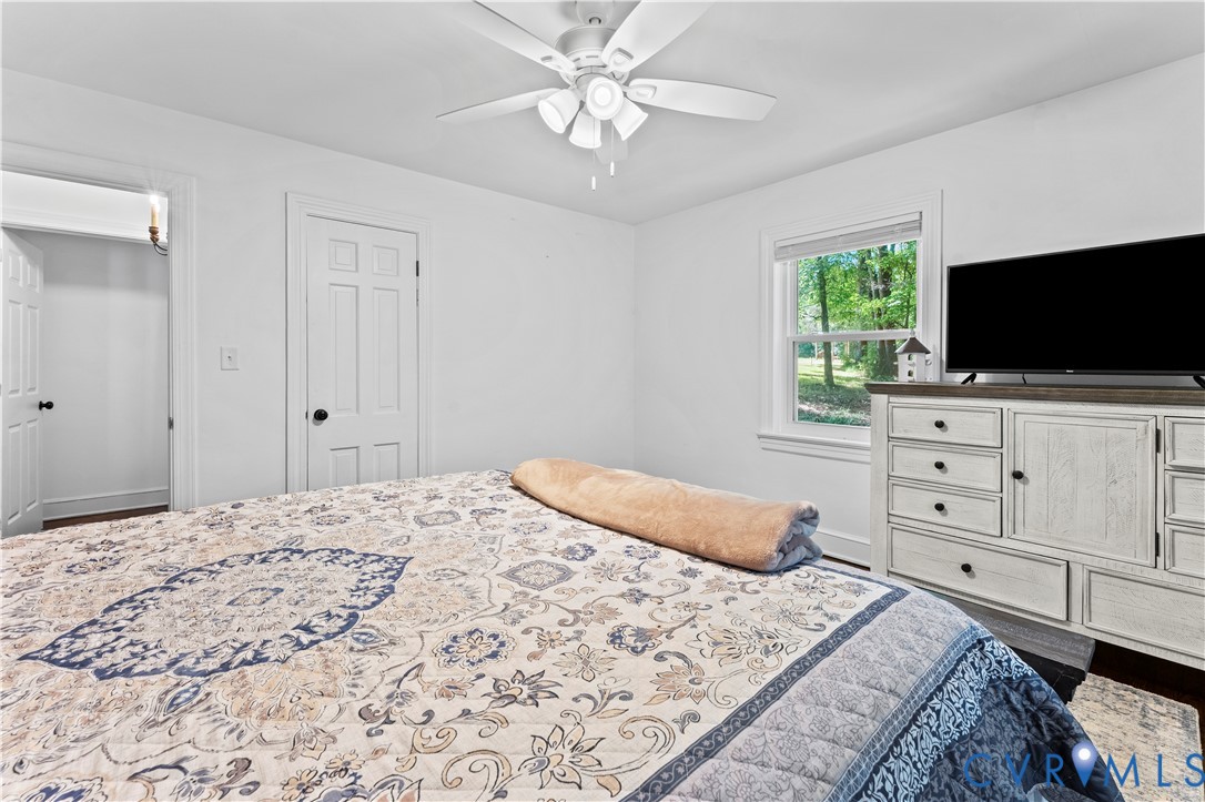 1159 Cedar Hill Road Blackstone, VA 23824 - Photo 14 of 45 a bedroom with a bed and a flat screen tv