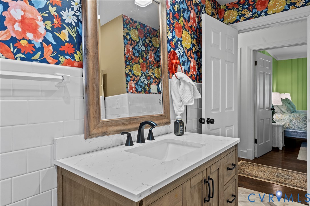 1159 Cedar Hill Road Blackstone, VA 23824 - Photo 18 of 45 a bathroom with a sink and a mirror