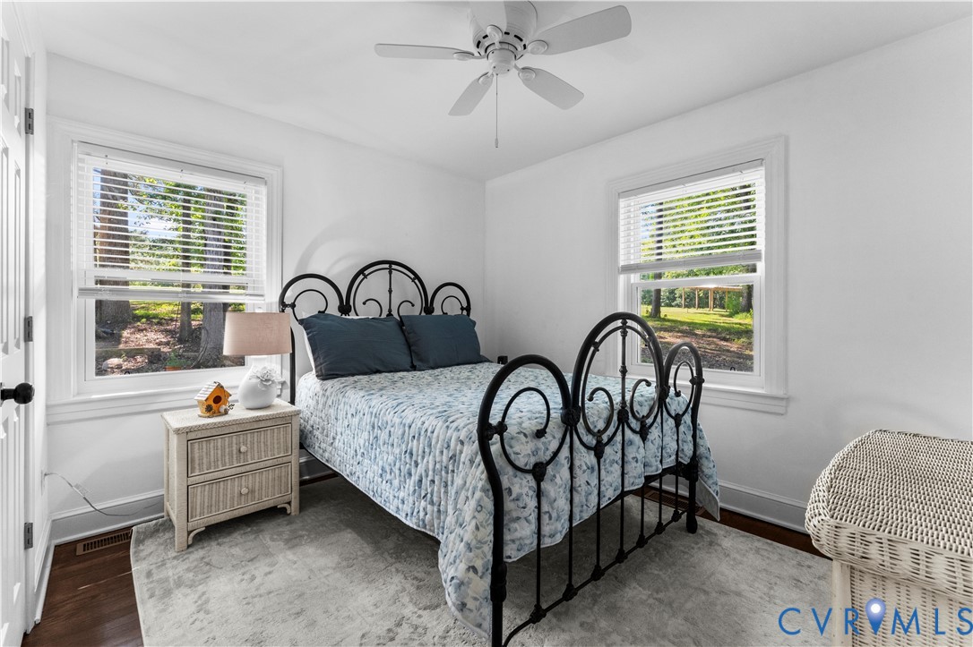 1159 Cedar Hill Road Blackstone, VA 23824 - Photo 20 of 45 a bedroom with a bed a dresser and windows