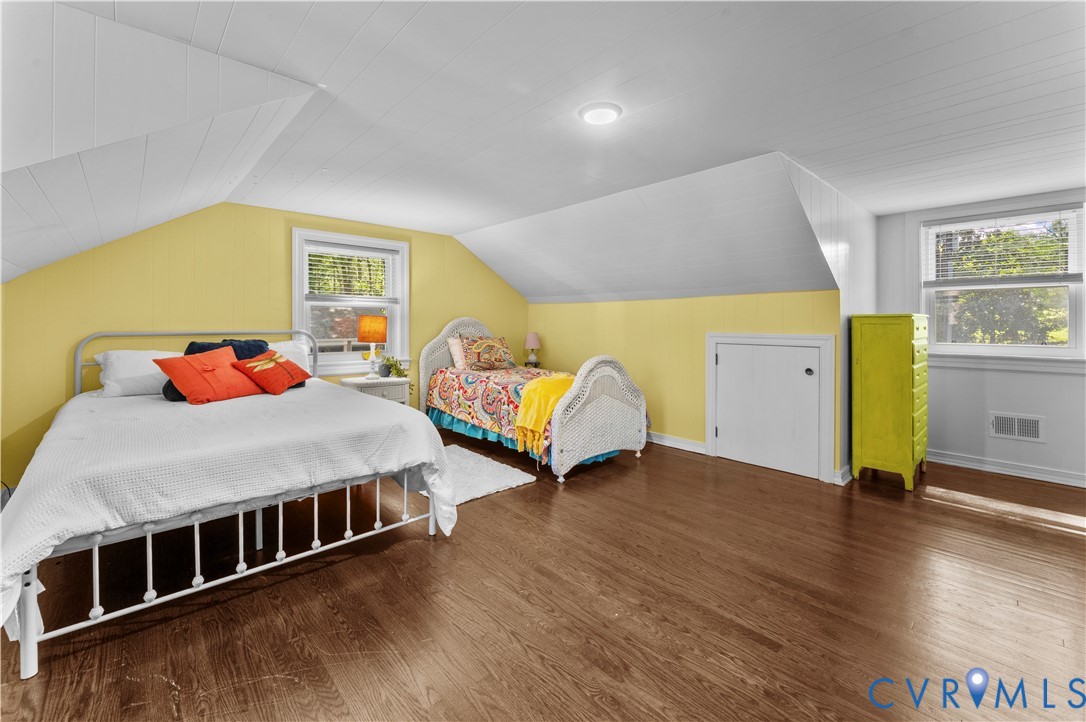 1159 Cedar Hill Road Blackstone, VA 23824 - Photo 24 of 45 a spacious bedroom with a bed and wooden floor