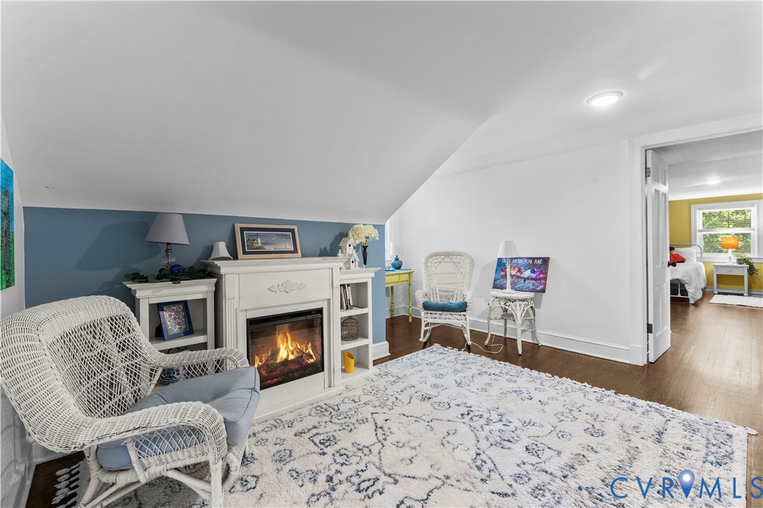 1159 Cedar Hill Road Blackstone, VA 23824 - Photo 26 of 45 a living room with furniture a flat screen tv and a fireplace