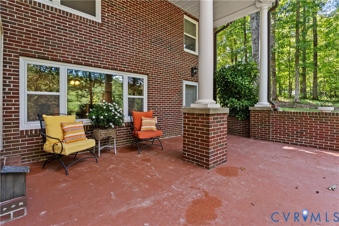 1159 Cedar Hill Road Blackstone, VA 23824 - Photo 36 of 45 a view of a patio with a table and chairs