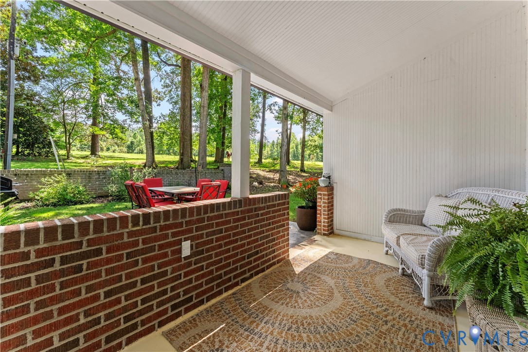 1159 Cedar Hill Road Blackstone, VA 23824 - Photo 41 of 45 a sitting area with furniture and garden view