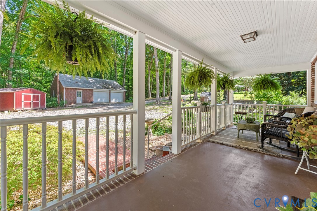 1159 Cedar Hill Road Blackstone, VA 23824 - Photo 6 of 45 a view of a porch with furniture and floor to ceiling window