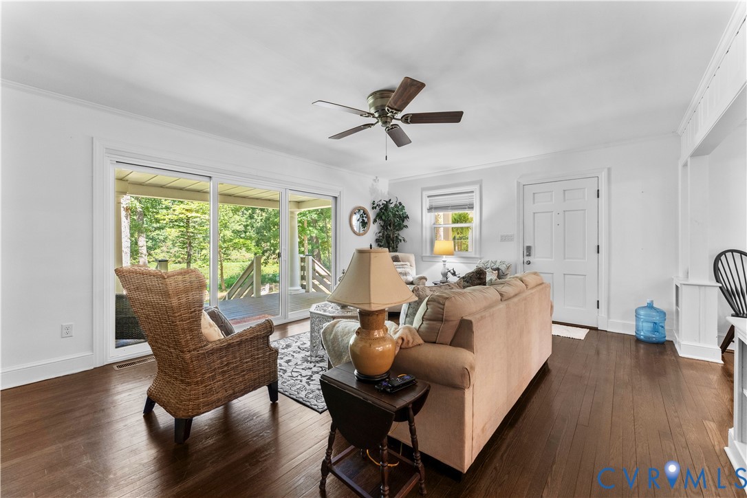 1159 Cedar Hill Road Blackstone, VA 23824 - Photo 8 of 45 a living room with furniture and a wooden floor