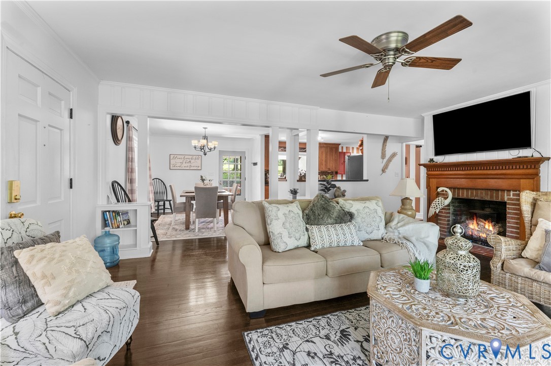 1159 Cedar Hill Road Blackstone, VA 23824 - Photo 9 of 45 a living room with furniture a fireplace and a flat screen tv