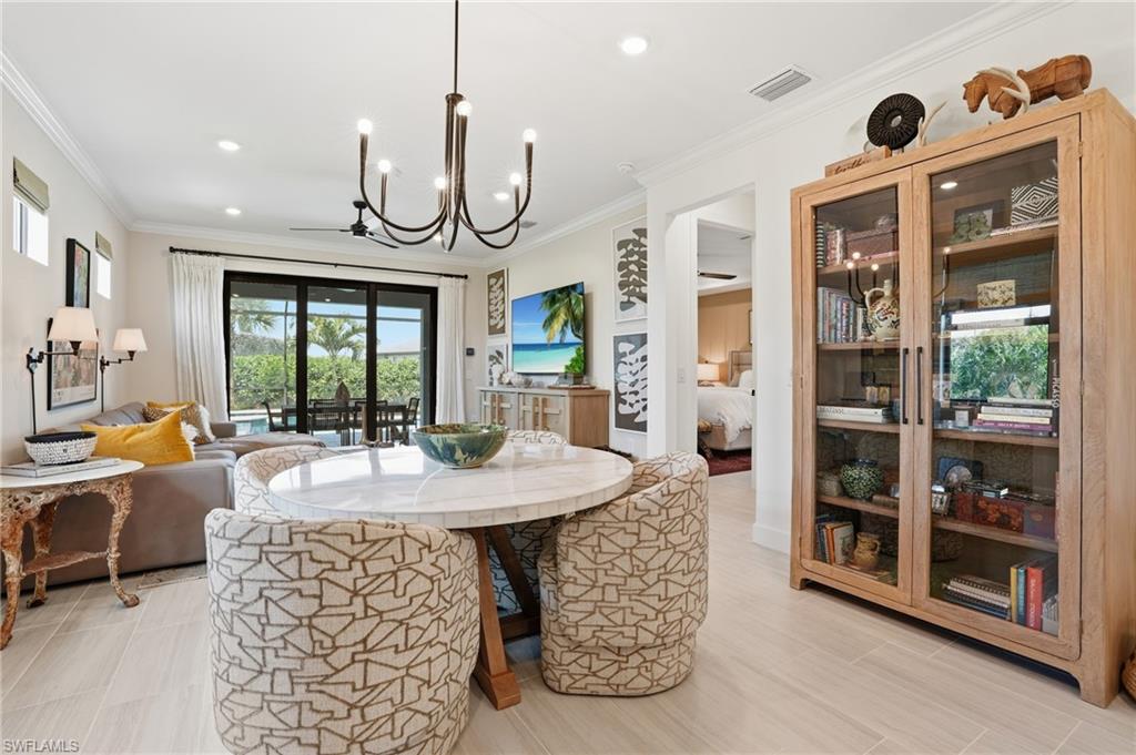 1955 Sierra Court Naples, FL 34120 - Photo 16 of 50 a large kitchen with a table and chairs