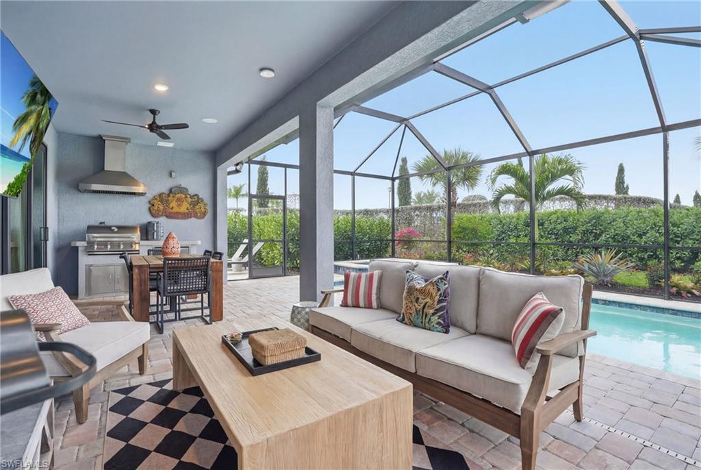1955 Sierra Court Naples, FL 34120 - Photo 25 of 50 a living room with furniture and a large window