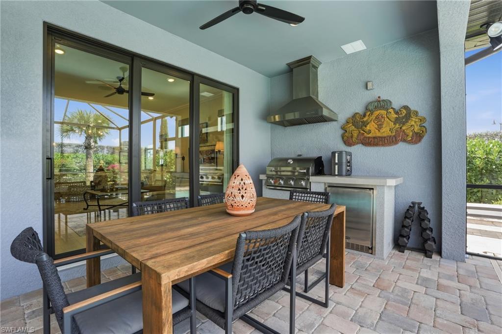 1955 Sierra Court Naples, FL 34120 - Photo 28 of 50 a dining room with furniture and chandelier