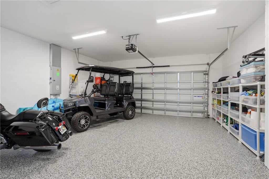 1955 Sierra Court Naples, FL 34120 - Photo 37 of 50 a view of a garage with storage