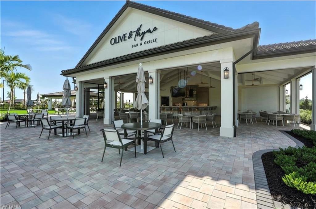 1955 Sierra Court Naples, FL 34120 - Photo 47 of 50 a view of a dinning table and chairs in the patio