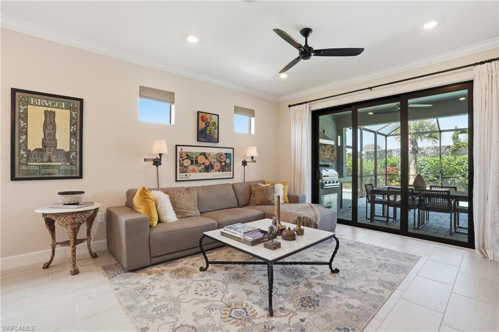 1955 Sierra Court Naples, FL 34120 - Photo 6 of 50 a living room with furniture a table and a large window