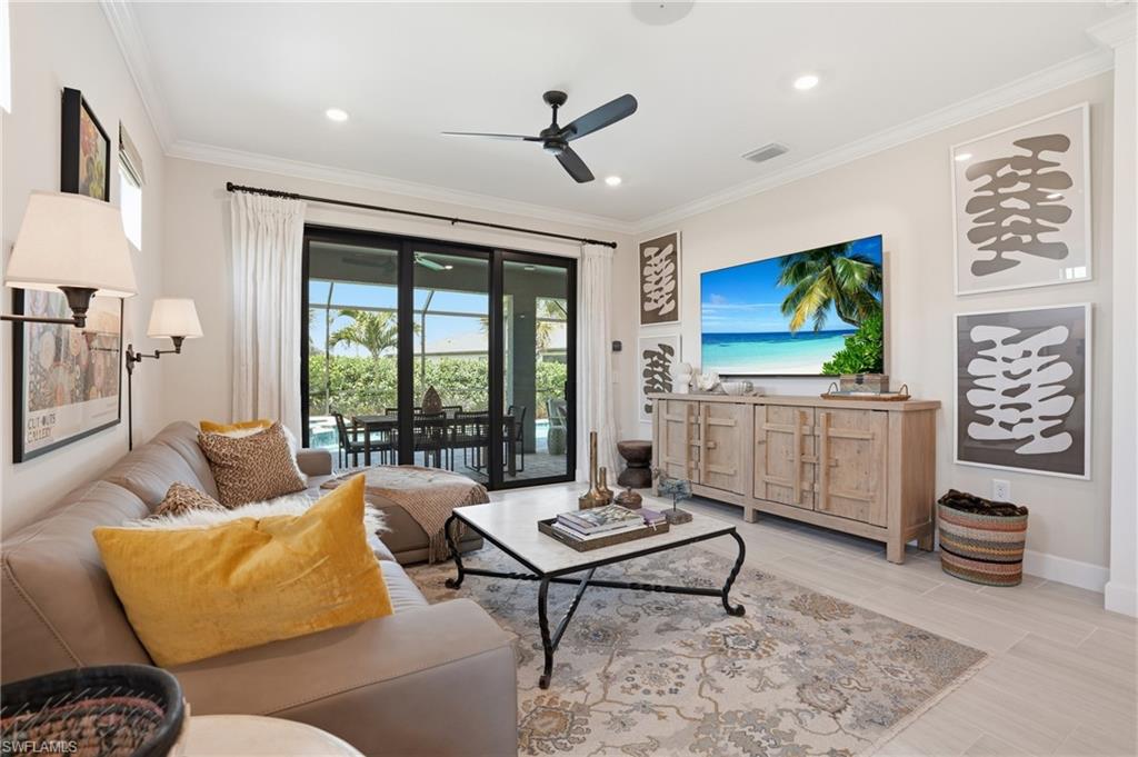1955 Sierra Court Naples, FL 34120 - Photo 7 of 50 a living room with furniture and a flat screen tv