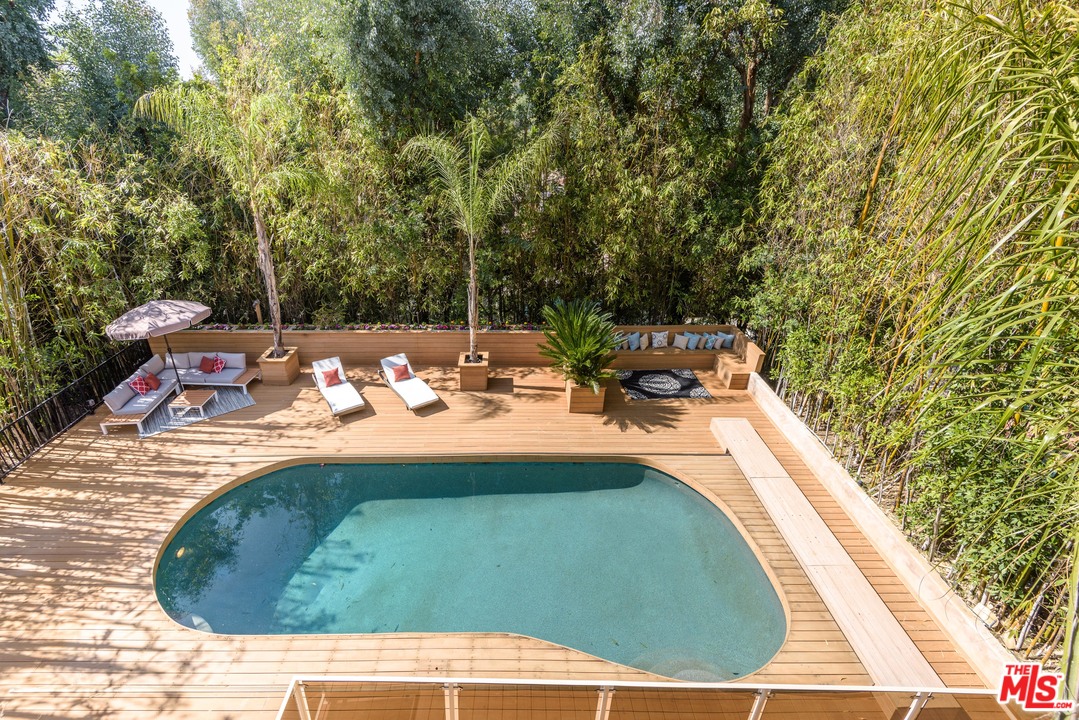 2663 Desmond Estates Road Los Angeles, CA 90046 - Photo 2 of 27 a view of a swimming pool with a patio