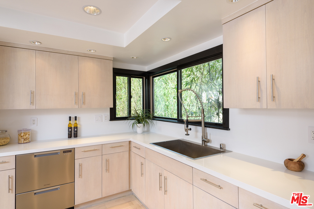 2663 Desmond Estates Road Los Angeles, CA 90046 - Photo 12 of 27 a kitchen with a sink window and cabinets