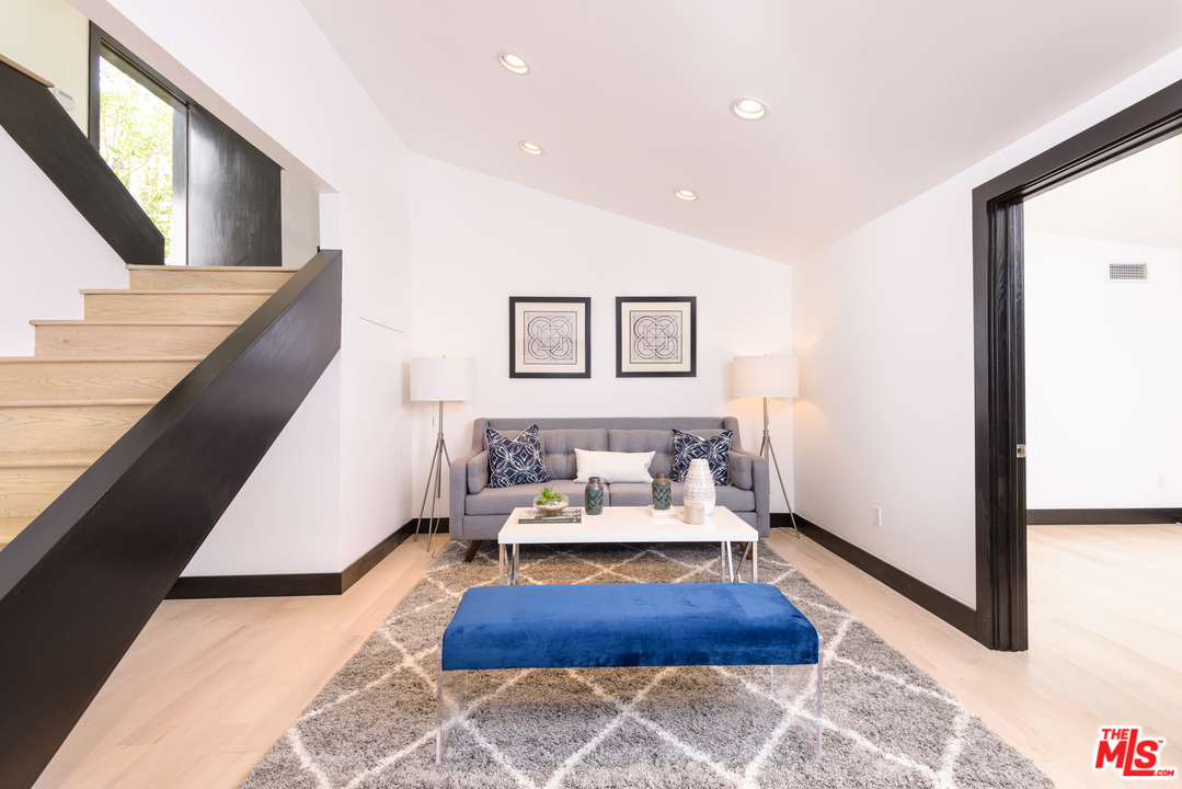 2663 Desmond Estates Road Los Angeles, CA 90046 - Photo 13 of 27 a living room with furniture and a rug