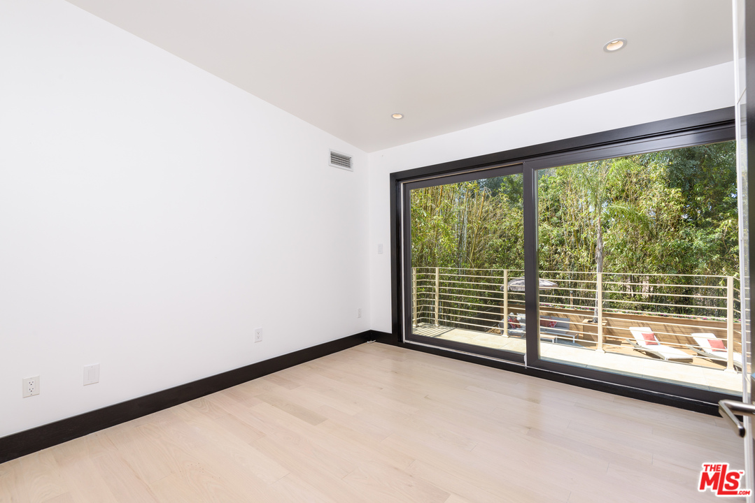 2663 Desmond Estates Road Los Angeles, CA 90046 - Photo 20 of 27 a view of a room with sliding window
