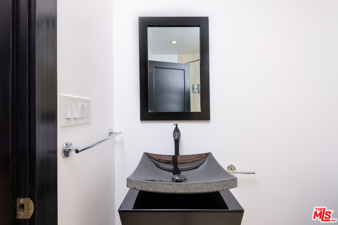 2663 Desmond Estates Road Los Angeles, CA 90046 - Photo 26 of 27 a sink and a mirror