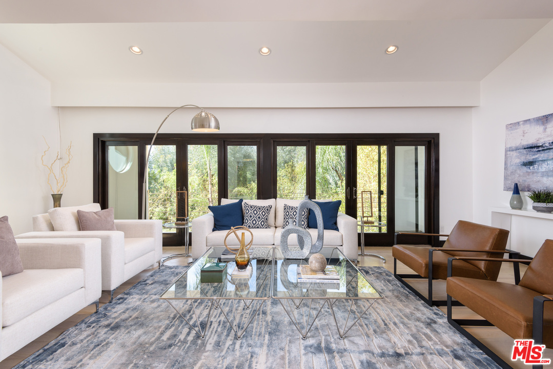 2663 Desmond Estates Road Los Angeles, CA 90046 - Photo 5 of 27 a living room with furniture and large windows
