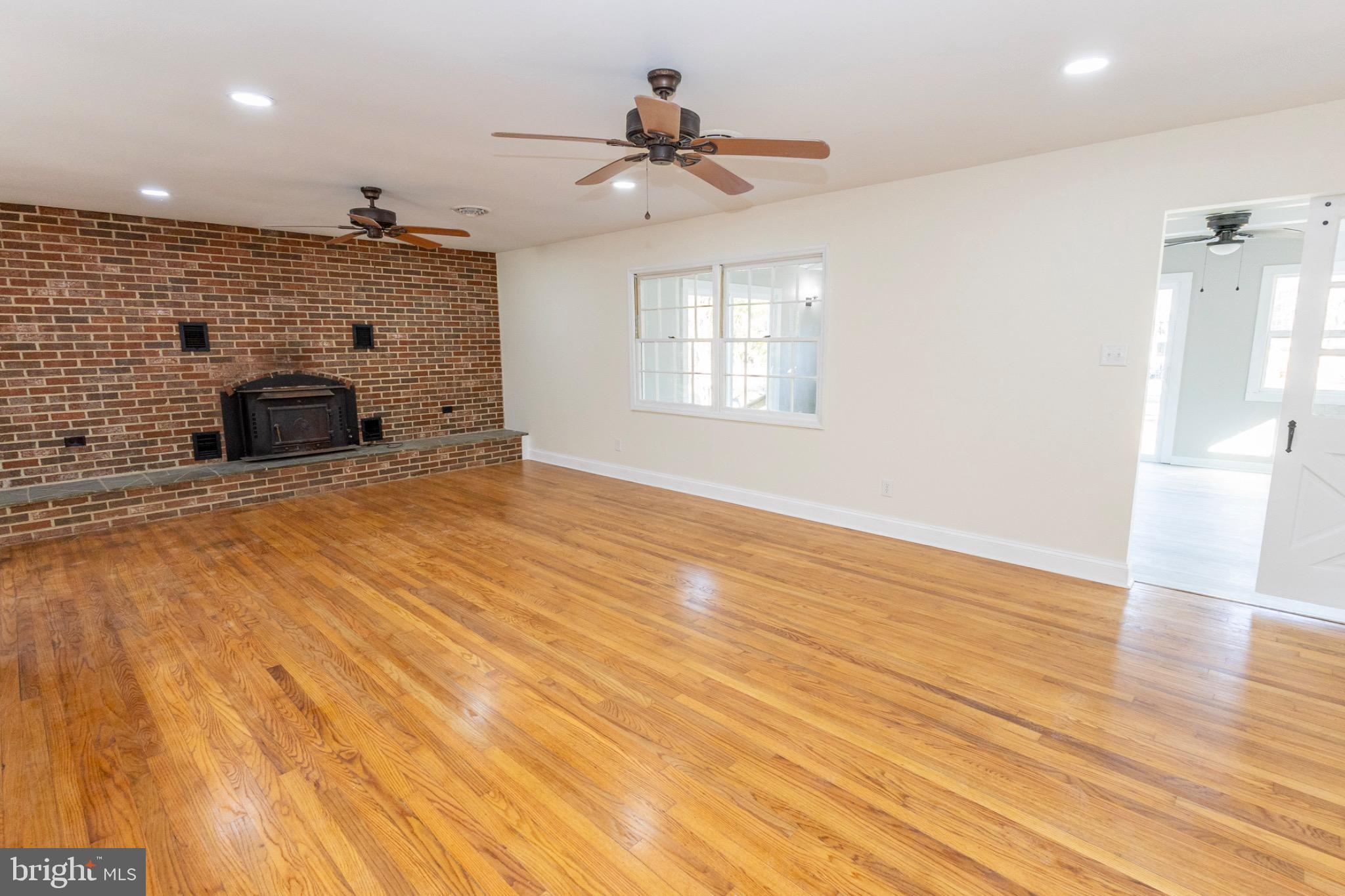 49151 Wynne Road Ridge, MD 20680 - Photo 21 of 80 Spacious living area with rustic charm.