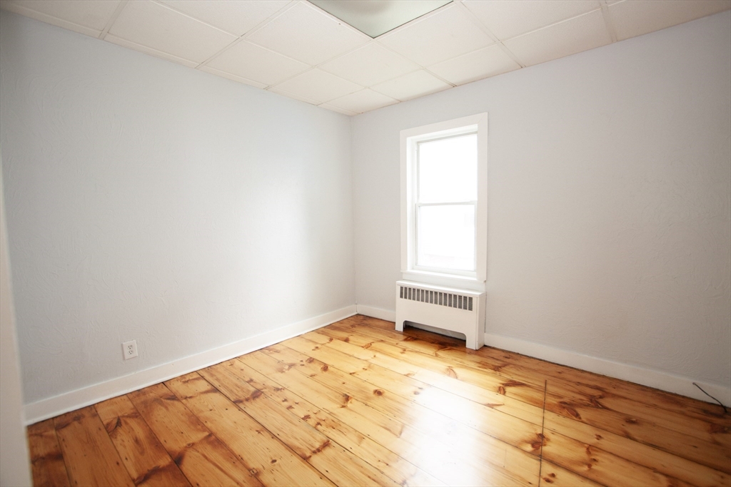 66 Cutler Street Worcester, MA 01604 - Photo 11 of 27 a view of empty room with wooden floor