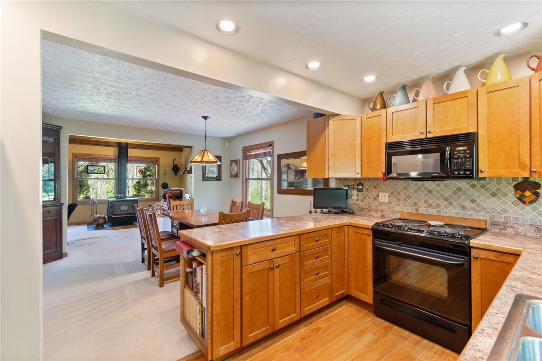4397 Sebring Road Sodus, NY 14551 - Photo 20 of 43 REAL TILE backsplash- custom cabinets and counters