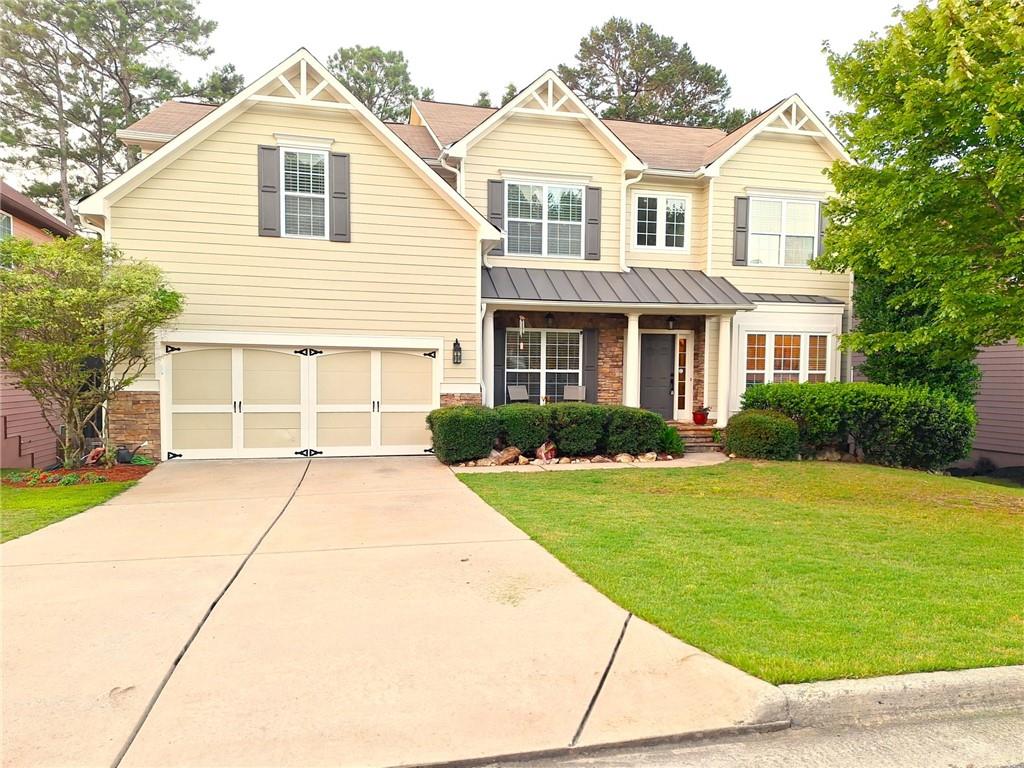 522 Blue Mountain Rise Canton, GA 30114 - Photo 1 of 1 a front view of a house with a garden