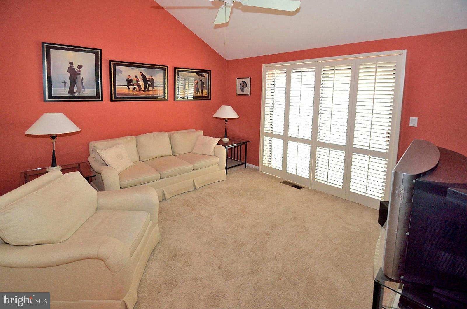 2111 South Bay Lane Reston, VA 20191 - Photo 14 of 30 a living room with furniture and a window