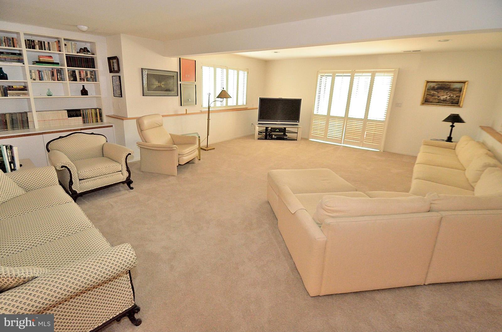 2111 South Bay Lane Reston, VA 20191 - Photo 23 of 30 a living room with furniture and a flat screen tv