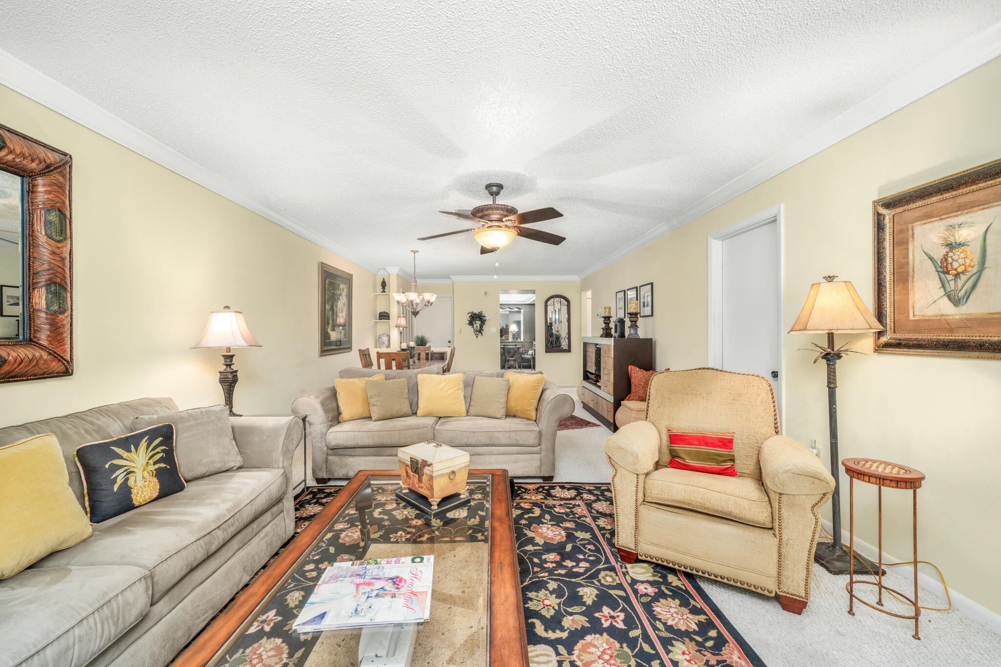 3833 Edgewater Drive Sebring, FL 33872 - Photo 13 of 51 a living room with furniture and a chandelier