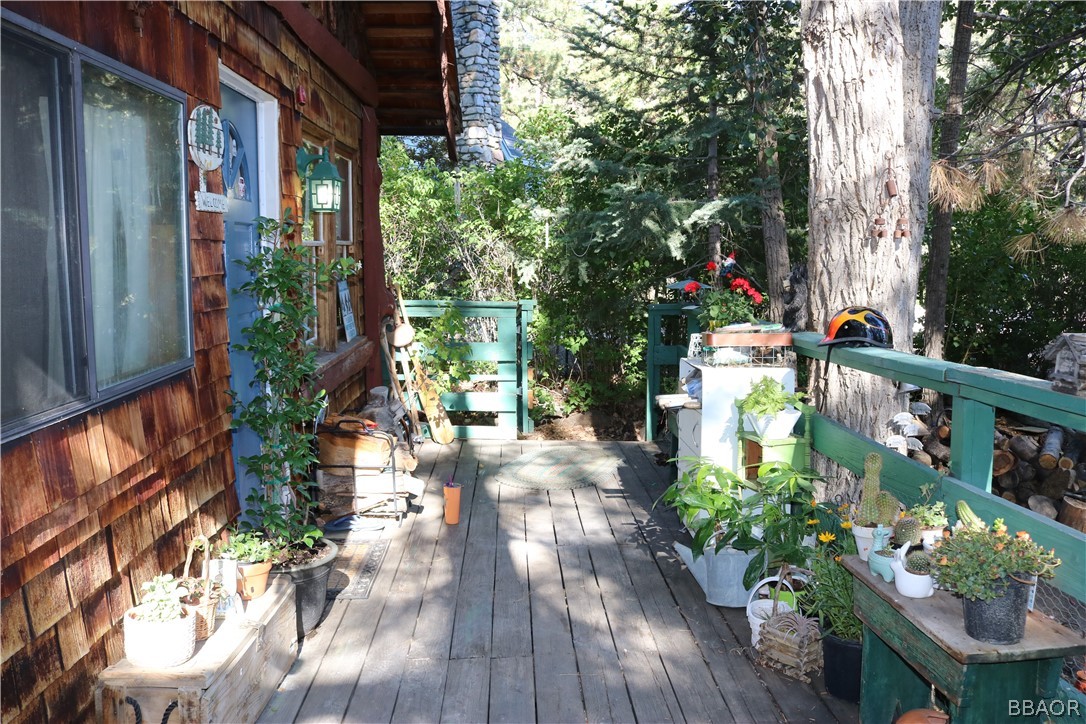 39372 Cedar Dell Road Fawnskin, CA 92333 - Photo 14 of 18 a backyard of a house with wooden floor yard and outdoor seating